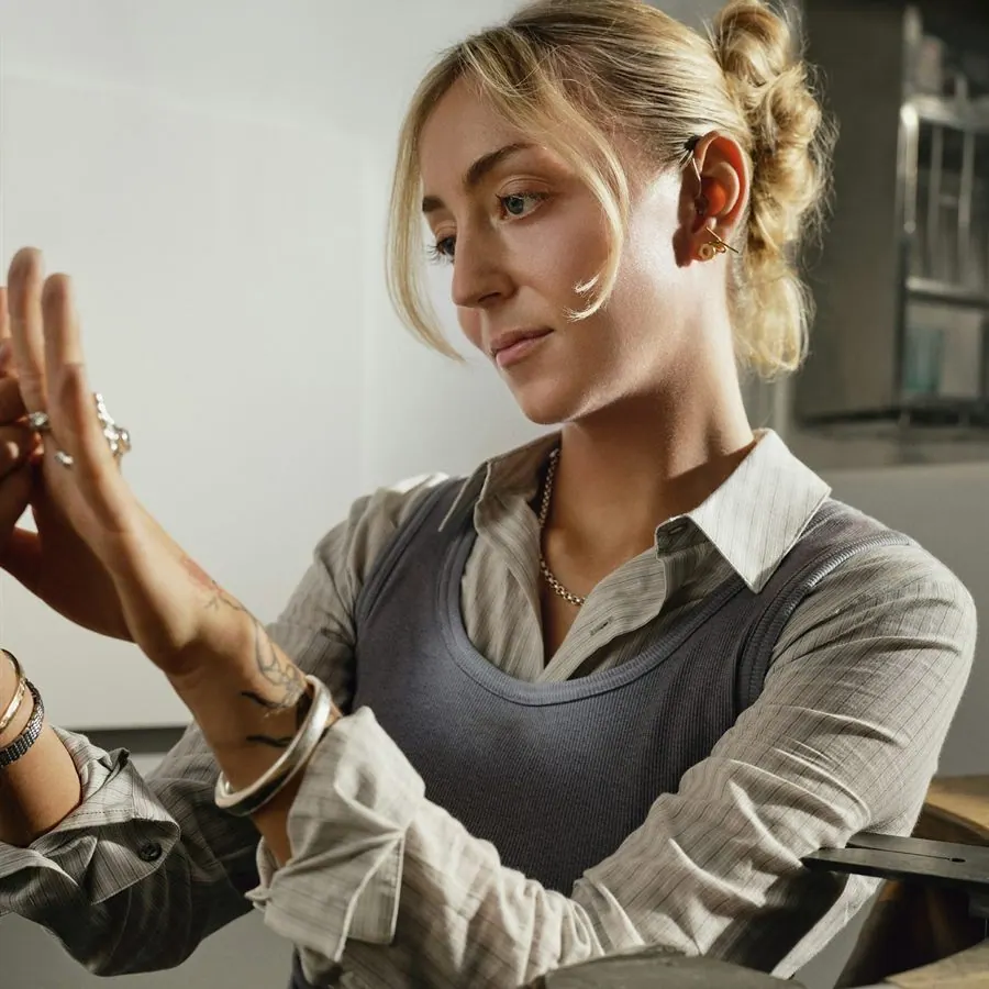 A jeweller examining a piece of jewellery